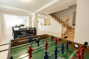 a group of toy men playing a game of pool at Casa Maya in Băile Govora