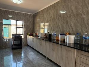 a large kitchen with a counter top in a room at Northam Square Mine Contractor Accommodation in Northam
