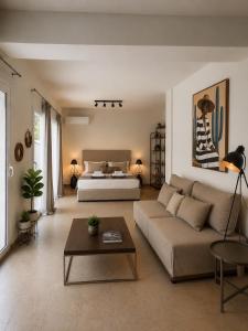 a living room with a couch and a bed at Themis Luxury Private Villa Rhodes with Private Pool in Ialysos