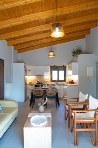 a living room with a couch and a table at Lefkada Town Condo in Lefkada
