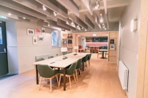 a dining room with a long table and chairs at CODE - The Court, Edinburgh in Edinburgh