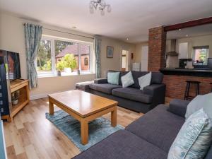 a living room with a couch and a coffee table at The Granary in York