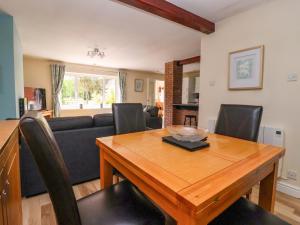 a living room with a table and a couch at The Granary in York