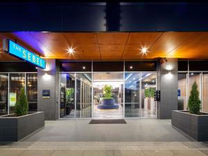 a building with a sign that reads the seez at The Sebel Canberra Civic in Canberra