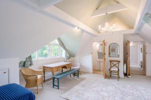 a bedroom with a table and chairs and a desk at 3 Bed in Ufford oc-sfmea in Ufford