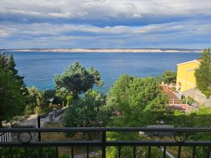 a view of the ocean from a balcony at Jelena Holiday House in Karlobag