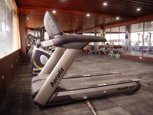 a gym with a treadmill in a room at Donyi Polo International in Itānagar