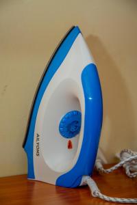 a blue and white iron sitting on top of a table at Mustard studio with free WI-FI in Nanyuki