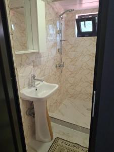 a bathroom with a sink and a shower at Old Capital in Mtskheta +117 photos