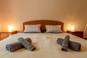 a bedroom with a bed with two towels on it at Tranquil condo in Golden Sands in Varna City +21 photos