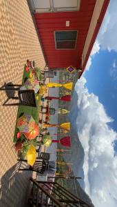 a view of a building with a bunch of umbrellas at Hotel Om Palace in Ukhimath +9 photos