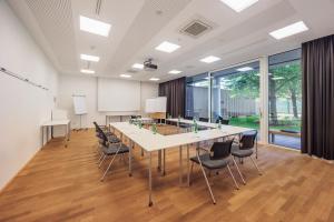 a conference room with a long table and chairs at Hotel Wallern Garni in Wallern an der Trattnach