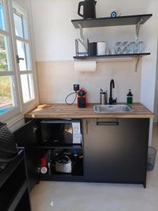a small kitchen with a sink and a counter at Seaview Apartment in Galissas - Blue Lagoon Complex A9 in Galissas