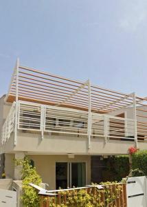 a large house with a large balcony on top of it at S'Olivariu in Pula