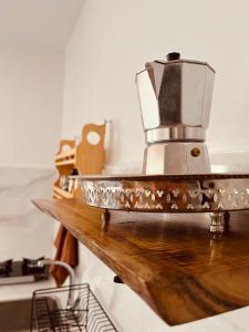 a coffee maker sitting on top of a wooden counter at Little Palm Camp in Imsouane