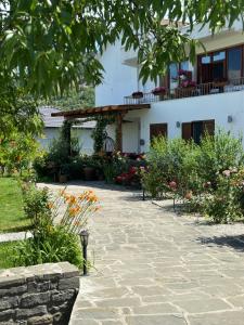 a stone walkway in front of a house at GuestHouse "Shtëpia ime" in Përmet