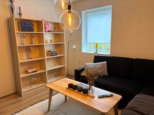 a living room with a couch and a coffee table at Dream house in Glesborg