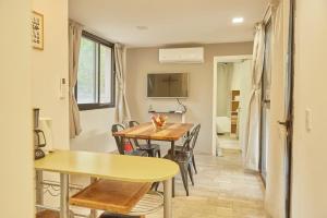 a dining room with a table and chairs at Entre Montañas - Vista Calma in Potrerillos