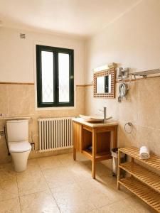 a bathroom with a toilet and a sink and a mirror at L'Imprevisto in Grasse +52 photos
