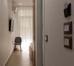 a door leading to a bedroom with a window at Sea La Vie Hotel in Durrës +31 photos