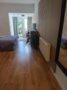 a room with a bed and a desk and a mirror at Apartment Linde Otzenhausen in Nonnweiler