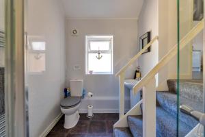 a small bathroom with a toilet and a sink at Finest Retreats - Seabreeze, Rhos On Sea in Rhos-on-Sea +17 photos