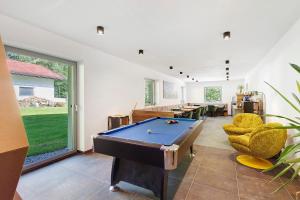 a living room with a pool table in it at Nature House Pflersch in Brennero