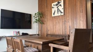 a dining room with a wooden table and chairs at New open - ねどことあさげナマケモノ Nedoko & Asage by Sloth - Japanese Traditional House in Ōno
