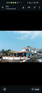 a screenshot of the iphone screen with a view of a building at Happy Stay in Vagamon