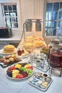 a table with many different types of food on it at 07-Founders Suite at The Castle Inn in Ocracoke