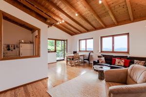 a living room with a couch and a table at Ferienhaus 146 in Arnoldstein