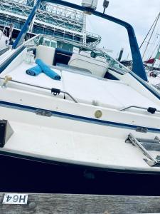 a boat is docked at a dock at VINA ROMANCE - Romantic Boat Stay in Lisbon Marina in Lisbon