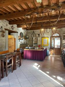 a large kitchen with a table in a room at Agriturismo Campo Rosso in Civitella di Romagna