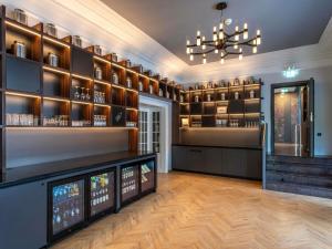 a wine tasting room with a chandelier and wine racks at Mercure Hotel Luebeck City Center in Lübeck