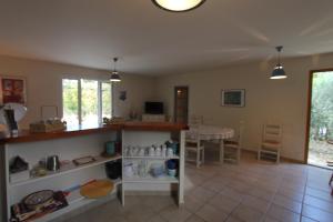 a living room with a counter and a table at Clos Christol in Graveson
