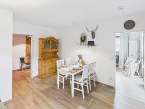 a white dining room with a table and chairs at Alpenblick 5 - Chiemgau Karte in Inzell +16 photos