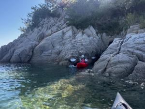 a couple of people in a kayak in the water at The Nine Kings in Imabari