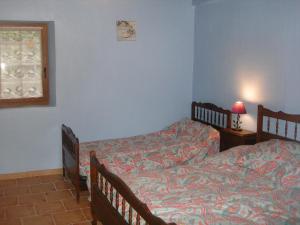 a bedroom with two beds and a window at Maison lacabane in Saint-Sever