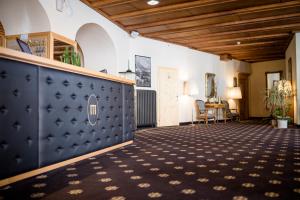 a large room with a black and white carpet at TH Samedan - Hotel Bernina 1865 in Samedan