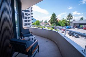 a balcony with a view of a parking lot at Waves Hotel NEW IN 2026 in Sarajevo