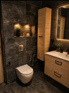 a bathroom with a toilet and a sink at Appart Hidaya in Fez +25 photos