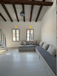 a living room with a couch in the middle of it at Samos Vista Azzurra 2 in Samos