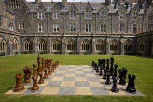 a chess board in front of a large building at Ancluaran - Moat House 10 in Fort Augustus