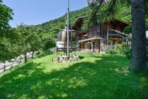 a helicopter is parked in front of a house at Chambre D'hôtes La Télécabine in La Balme-de-Thuy +13 photos