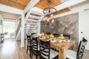 a dining room with a wooden table and chairs at Pool & Spa - Chalet Le Misco in Beaupré +24 photos