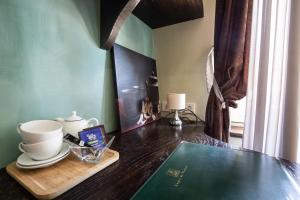 a table with a tray with cups and plates on it at Beauséjour in Calvinet