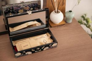 a wooden table with a box on top of a table at YUONJAE Jongno in Seoul