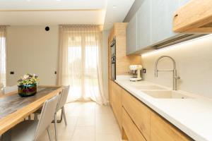 a kitchen with a sink and a counter at Casa di Babii in Serle +45 photos