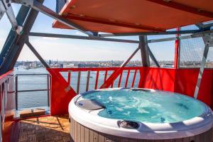 a hot tub on the top of a cruise ship at Faralda Crane Hotel in Amsterdam