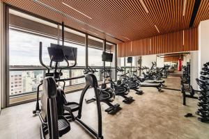 a gym with a bunch of exercise equipment in a building at Movinn Nine - Jardim Paulista in São Paulo